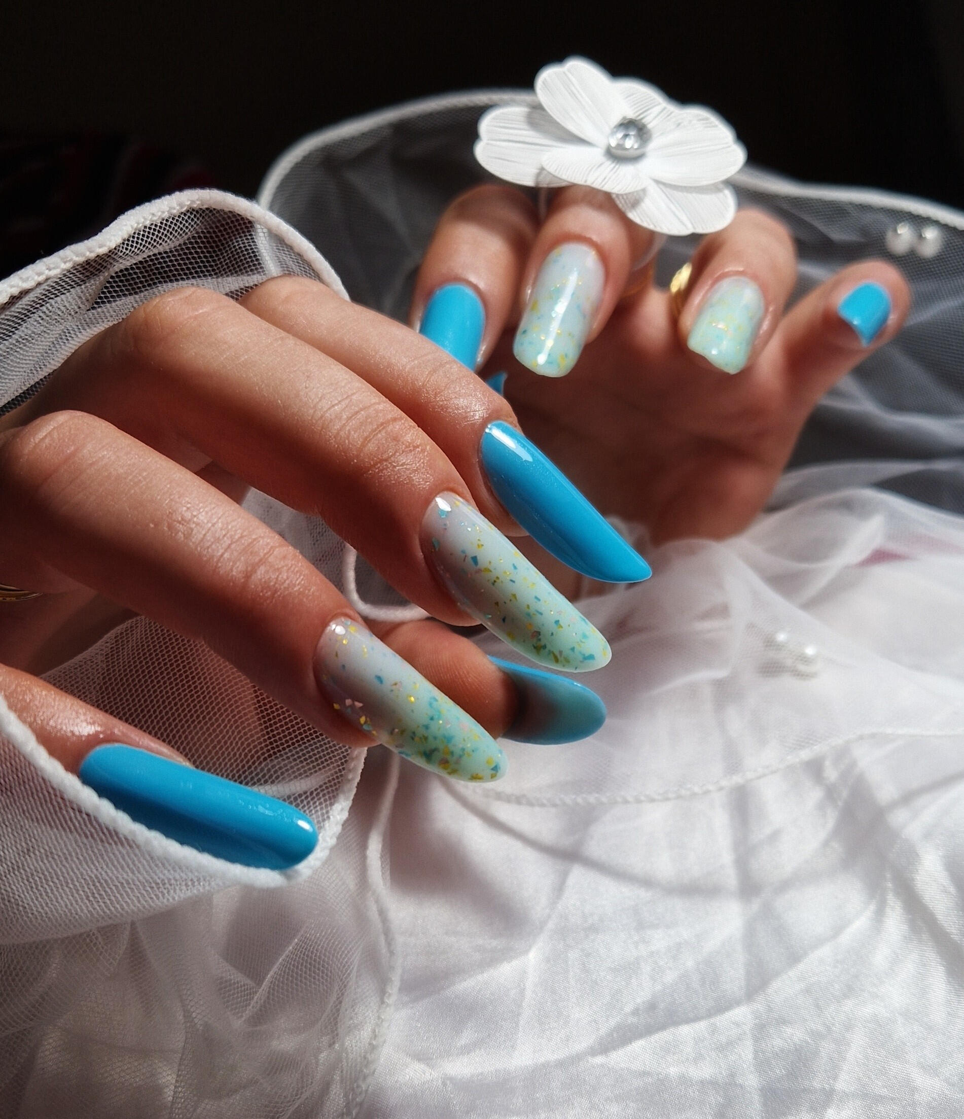 Long, bold, and absolutely beautiful with golden glitter flakes